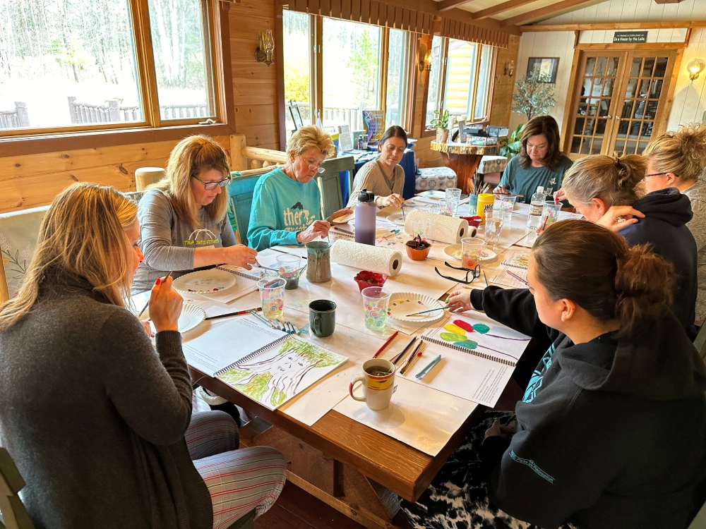 A group of people sitting around a table.